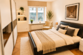 Stilvoll modernisierte 2,5-Zimmer-Wohnung im denkmalgeschützten Haus Rheinpark - Schlafzimmer - KI-gestützte Visualisierung – die Darstellung wurde digital verändert.