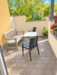 Luxuriöse Erdgeschosswohnung mit Sauna, Whirlpoolbadewanne und eigenem Gartenanteil - Sonnige Terrasse mit KI bearbeitet